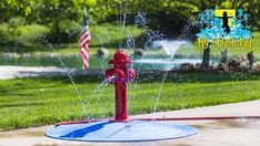 a red fire hydrant spewing water on top of it's head