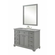 a bathroom vanity with a mirror above it and drawers under the sink, in grey