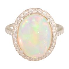 Natural Opal Ring with Diamond Halo Luxury White Opal Cabochon Ring, White Opal Ring With Gemstone Accents, White Ethiopian Opal Ring For Formal Occasions, Formal White Ethiopian Opal Ring, Opal Jewellery, Hair Clothes, Gem Stones, Romantic Gifts, Romantic Gift