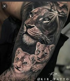 a man's arm with an image of two lions and a tree on it