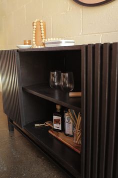 a shelf with some wine glasses on it