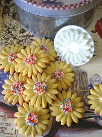 some yellow flowers are sitting on a table