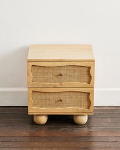 a wooden table with two drawers on it