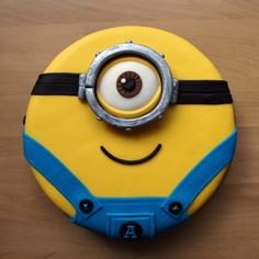 a birthday cake with a minion face on it