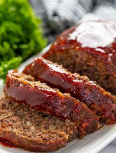 slices of meatloaf on a plate with broccoli