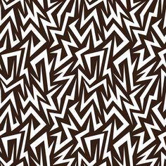 a brown and white background with many small triangles on it's sides, all in the same direction