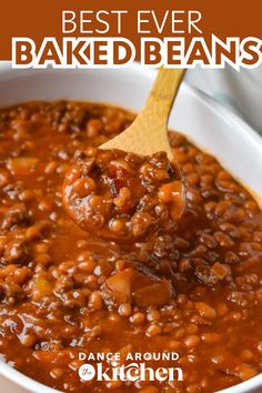 a spoon full of baked beans in a white bowl with the words best ever baked beans