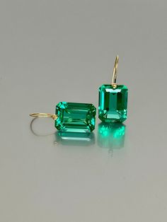 Beautiful Colombian emerald earrings in Brilliant drops. The faceted rectangle drops have a gorgeous Caribean ocean green color that brings lots of depth to the stone and reflects lights beautifully. The fancy drops are attached to 24K Gold Vermeil/ 14K Solid gold ear wires. The earrings are elegant, minimalist, and have a lux look.  A truly gorgeous pair of earrings. When 14K SOLID GOLD ear wires are being used, the ear wire ends are hand-stamped as proof of being 14K solid gold. In addition, e Emerald Jewellery, How To Clean Metal, Colombian Emeralds, May Birthstone, Types Of Gemstones, Jewellery Gift, Emerald Earrings, Emerald Jewelry, Rose Gold Jewelry