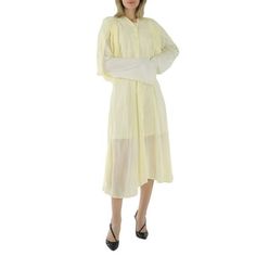 Acne Studios Ladies Dresses. SKU: A20417. Color: Pale Yellow. Acne Studios Ladies Pale Yellow Layered Long Sleeve Dress. Acne Studios pale yellow long sleeve dress layers a lightweight pleated viscose over a jersey base. Detailed with delicate draping, a rippled hemline and elongated cotton sleeves. 100% viscose. Contrast: 85% cotton, 15% hemp. Size: 2.  Gender: female.  Age Group: adult. Yellow Long Sleeve Maxi Dress For Work, Long Sleeve Maxi Dress For Daytime, Long Sleeve Midi Dress For Daytime Spring, Spring Long Sleeve Midi Dress For Daytime, Spring Daytime Long Sleeve Midi Dress, Yellow Long Sleeve Dress For Daytime, Dress Layers, Yellow Long Sleeve Dress, Beige Midi Dress