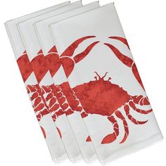 four napkins with red crabs on them are sitting side by side in front of a white background