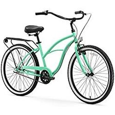 a green bicycle is shown against a white background and has black spokes on the front wheel