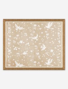 a beige and white wall hanging with birds, flowers and leaves on it's side