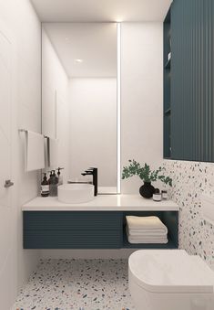 a modern bathroom with blue and white decor