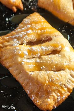 some food that is sitting on top of a black plate in the air fryer