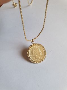 Solid gold coin necklace, gold coin pendant necklace, antique necklace, British coin gold necklace, 14k gold necklace Solid gold 14k necklace with an old british gold coin pendant, great for everyday wear, unique and beautiful. The chain is made of 14k solid gold and available in a few styles and lengths and the pendant is an original coin which I decorate with twisted gold wires and is available in 9k or 14k solid gold. Dimensions: The coin pendant's diameter is about 0.75 inch (2 cm). There ar Coin Necklace Gold, Gold Coin Pendant, Gold Coin Necklace, Peridot Necklace, Antique Coins, Coin Pendant Necklace, Solid Gold Necklace, Necklace Antique, 14k Gold Necklace