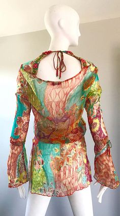 For Sale on 1stDibs - Stunning Vintage 1990s MAURIZIA BYOUX colorful mixed patterned silk chiffon Italian tunic blouse! Features beadwork along the neckline. Bell sleeves have Colorful Fitted Bohemian Tops, Multicolor Sheer Party Tops, Multicolor Sheer Top For Party, Multicolor Sheer Tops For Party, Multicolor Vibrant Print Festival Blouse, Summer Fitted Silk Chiffon Blouse, Fitted Silk Festival Tops, Bohemian Style Multicolor Blouse For Party, Silk Fitted Tops For Festival