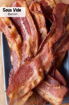 bacon strips piled up on a plate with the words sous vide in front of them