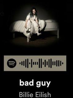 a woman sitting on top of a bed in front of a sound equalizer with the caption bad guy