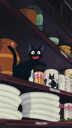 a black cat standing on top of a shelf next to stacks of plates and cups