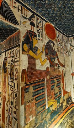 an egyptian painting on the side of a wall in a room with many different colors and designs