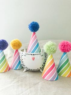 "POM PARTY HATS! You asked and I heard ya - you need a hat for a little (or big) head? I've got you covered. Hats are made of premium paper with a printed pattern, Poms are handmade. Hat measures 2.5\" across and 3.5\" tall. Hats look good on babies, adults even pets! Hats come assembled with a white elastic band - you can remove it if you wish to use a bobby pin or something else to hold it in place. LISTING IS FOR 1 POM HAT Need something custom? Message me! $1.50 extra per custom item Need a Fun Multicolor Costume Hats And Headpieces, Fun Multicolor Birthday Hats, Novelty Multicolor Birthday Hat, Cute Multicolor Hat For Birthday, Cute Multicolor Birthday Hat, Playful Multicolor Hats For Gifts, Playful Multicolor Party Hats, Playful Curved Brim Hat For Birthday, Playful Curved Brim Birthday Hat