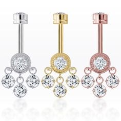 three different types of piercings with diamonds