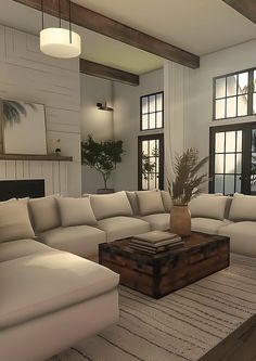 a living room filled with lots of white furniture and large windows in the back wall