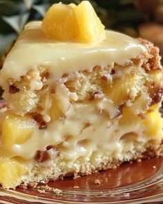 a close up of a piece of cake on a plate with pineapple toppings