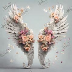 two white angel wings with flowers and butterflies on them in front of a gray background