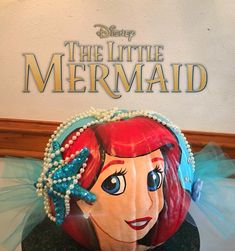 the little mermaid cake is decorated with pearls