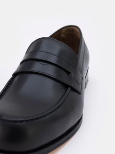 Color: black Cow leather with natural finish Penny front Leather insoles Rubber and leather soles Hand-stitched detailing Leather Round Toe Slip-ons For Business, Classic Closed Toe Slip-ons With Rubber Sole, Business Leather Slip-on Shoes With Rubber Sole, Black Loafers For Business With Round Toe, Black Round Toe Loafers For Business, Black Business Loafers With Round Toe, Black Loafers With Stitched Sole And Round Toe, Business Loafers With Rubber Sole And Round Toe, Black Slip-ons With Leather Lining And Round Toe