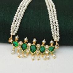 This traditional puneri pearl green stone studded tanmani can be beautifully worn with traditional outfits, festive wear, party wear, or even casual wear. The right gift for the lady love Surprise the love of your life on a very special day be it an anniversary, birthday, party, Valentine, or any other festival.Specially maharashtrian wedding ceremony. This peshwai green stone tanmani denhance your beauty. So buy now! So Hurry Up and Order Now! Traditional Green Jewelry With Stone Work, Traditional Green Stone Work Jewelry, Traditional Green Jewelry With Stone Setting, Green Kundan Temple Necklace For Gift, Green Kundan Necklace With Stone Setting In Temple Style, Temple Style Green Kundan Necklace With Stone Setting, Green Temple Jewelry With Stone Setting, Green Tilla Jewelry For Puja, Green Bollywood Necklace For Puja