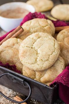 cinnamon sugar cookies in a basket with cinnamon sticks