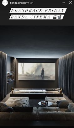 an image of a living room setting with couches and a projector screen on the wall