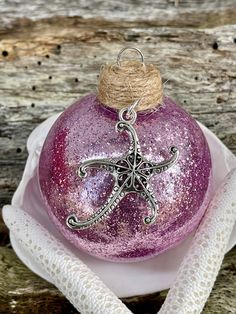 a glass ornament with a starfish on it