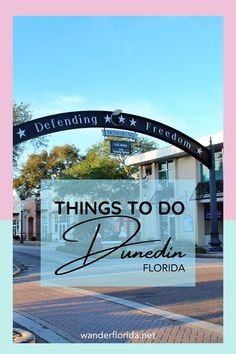 an arch with the words things to do in anaheim, florida on it and a street sign