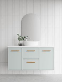 a bathroom with a sink, mirror and cabinets