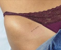 a woman's stomach with the word love written in cursive writing on it