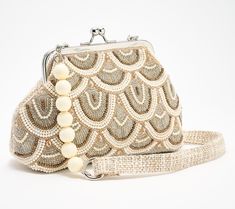 The perfect evening bag or a cute clutch that adds a little glam to your everyday look, this hand-beaded beauty is a versatile pick for any occasion. Go hands-free with the luxe chain strap and comfy shoulder pad so you can raise a toast without worrying. The delicate snap closure adds a little touch of lovely, while ensuring all your items remain secure. From America & Beyond. Beaded Frame, Fitness Jewelry, Kim Gravel, Adaptive Clothing, Yard Care, Miz Mooz, Cuddl Duds, Susan Graver, American Leather