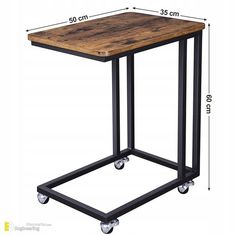 the table is on wheels and has a wooden top with black metal legs, which are also