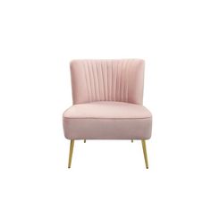 a pink velvet chair with gold legs