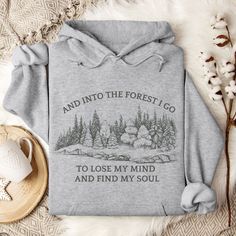 Forest hoodie, Outdoor sweatshirt: And into the forest I go to lose my mind and find my soul. Great hiking sweatshirt or camping sweatshirt for nature lovers. Hiking hoodie for dad and camping gift him, hiking hoodie for forest lovers. ✔️50% cotton, 50% polyester ✔️Pre-shrunk ✔️ Classic fit ✔️Medium-heavy fabric  RETURNS AND EXCHANGES Every sweatshirt/hoodie is printed soon after you place your order. Returns and exchanges are accepted if you received a defective, damaged, or a wrong item. If that's the case, please contact me directly to get you a replacement.  Please choose carefully by selecting the right size and color. If you have any questions or special requests, please contact me!  SHIPPING TIME: 7-10 days. WASHING INSTRUCTION - Wash garment inside out, in cold water, in gentle cyc Cozy Hoodie For Outdoor, Midweight Hoodie Sweatshirt For Outdoor, Winter Hoodie For Outdoor Activities, Crew Neck, Graphic Print Hoodie For Hiking In Winter, Outdoor Sweatshirt, Hiking Hoodie, Hiking Sweatshirt, Forest Hoodie, Camping Sweatshirt