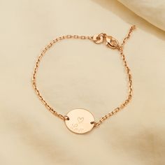 Our dainty Personalized Pastille Chain Bracelet features a delicate chain with a smooth disc and your hand-engraved initials or numbers, perfect for stacking with other designs or wearing alone.18K Champagne Gold Plated, 925 Sterling Silver or 18K Rose Gold PlatedChain length: 7, adjustable to 6.3Pastille charm: 0.6 x 0.6Hand-engraved in our Paris workshopSent with love in a complimentary gift boxAny slight variations in lettering depth, spacing and alignment from the examples shown are part of Dainty Engraved Charm Bracelet, Engraved Rose Gold Sterling Silver Name Bracelet, Minimalist Engraved Rose Gold Name Bracelet, Dainty Engraved Name Bracelet, Dainty Engraved Rose Gold Name Bracelet, Dainty Yellow Gold Name Bracelet, Rose Gold Tarnish Resistant Charm Bracelet, Engraved Minimalist Bracelets, Minimalist Engraved Charm Bracelet