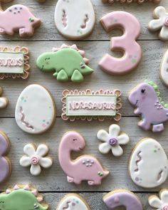 decorated cookies are arranged on a table with the numbers 3, 5, and 8