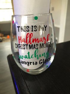 a wine glass that has writing on it