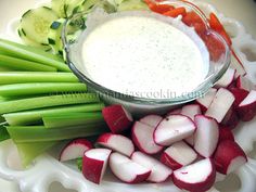 sliced celery, radishes and cucumbers on a plate