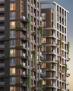 two tall buildings with plants growing on the balconies