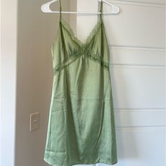 Love Triangle Light Green Lace Trim Mini Dress Spring Mini Dress With Lace Trim For Sleep, Green Spaghetti Strap Sleep Dress, Casual Green Slip Dress For Brunch, Green V-neck Slip Dress For Daywear, Mini Length Slip Dress For Sleep In Spring, Green Sleeveless Sleepwear With Lace Trim, Green V-neck Summer Sleepwear, Spring Green Sleeveless Sleepwear, Casual Green Dress With Lace Trim