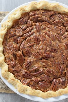 a pecan pie is shown on a white plate