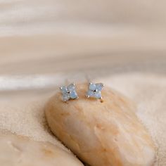 Indulge in the delightful allure of our Ivy Flower Studs, designed to seamlessly transition you through the seasons. The enchanting light blue stones and intricate flower motif bring a unique twist to your everyday studs, making it a perfect addition to your jewelry collection ♡ Material: High Quality Solid 925 Sterling Silver Finish: Sterling Silver ∙ 18K Gold Featuring ~4mm Light Blue CZ Stone Flower Studs Sold as a pair Part of the Under The Sea Collection Model showcases a cute & dainty boho Caitlyn Minimalist, Aquamarine Stacking Ring, Earring Stacks, Light Blue Earrings, Ivy Flower, Emerald Cut Solitaire Ring, Initial Tag Necklace, Sideways Initial Necklace, Blue Stud Earrings